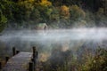 Early morning autumn mists by the Old Boathouse Royalty Free Stock Photo