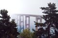 Misty Bridge over Calm Waters Royalty Free Stock Photo