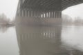 Misty bridge.After the time has elapsed, the density of fog under the bridge is gradually diluted and melts.