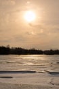 Misty calm evening on the forest lake is illuminated by the colors of sunset, melting ice, reflection in the water mirror Royalty Free Stock Photo