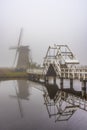 Misty and Calm windmill sunrise Royalty Free Stock Photo