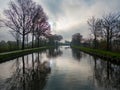 Misty Canal Morning: A Reflection of Serenity