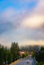 Misty Clouds Over The Banff Town Road