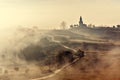 Misty country landscape with church