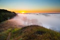 Misty dawn from hill over Valley and the forest Royalty Free Stock Photo