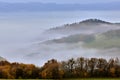 Misty early morning. Autumn landscape with forest and hills in the background. Royalty Free Stock Photo