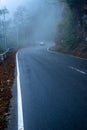 misty fog over empty road in mountains