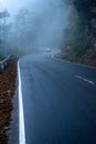 misty fog over empty road in mountains