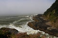 Misty and foggy morning on the beaches of Arch Cape, Oregon Coast Royalty Free Stock Photo