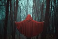 Red hooded figure