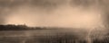 Misty gloomy coastal landscape in antique old photograph style