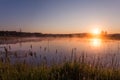 Misty Golden Sunrise Reflecting over Lake in Spring Royalty Free Stock Photo