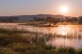 Misty Golden Sunrise Reflecting over Lake in Spring Royalty Free Stock Photo