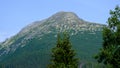 Misty horizons blue tones. Mountain landscape with sheer stone rocky slopes of High Tatra Mountains, Slovakia