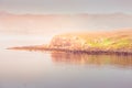 Misty island - Isle of Skye covered in morning mist Royalty Free Stock Photo