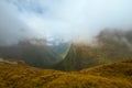 Misty landscape and fog covered mountains, New Zealand Milford track Fiordland