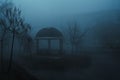 misty landscape with a gazebo by river on an autumn morning in the fog mist Royalty Free Stock Photo