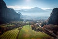 Misty layer of mountains around Meteora, Greece in sunlight