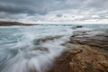 A misty moody seascape photographed on a cloudy, stormy day