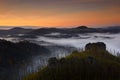 Misty morning. Czech typical autumn landscape. Hills and villages with foggy morning. Bohemian Switzerland park, Jetrichovice, Royalty Free Stock Photo