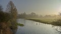 Misty morning light on the River Meon near Exton, South Downs National Park, Hampshire, UK