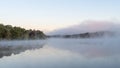 Misty morning - the mist and trees around the lake creating a dreamy scene