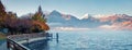 Misty morning panorama of Zell lake. Picturesque autumn view of Austrian Alps, with Grossglockner peak on background. Beauty of Royalty Free Stock Photo