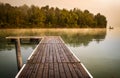 Misty morning pier at the lake Royalty Free Stock Photo