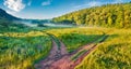 Misty morning view of the river valley with two old country roads. Royalty Free Stock Photo