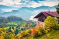 Misty morning view of Stansstad village, Switzerland, Europe. Fresh autumn scene of Lucerne lake.