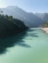 Misty morning wlecomes the day as the river Ganga flows gently murmuring between the hills