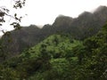 Misty Mountain Cliffs near Hanakapiai Falls along NaPali Coast on Kauai Island, Hawaii. Royalty Free Stock Photo