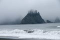 Misty Mountain with Forest on the seashore at Rialto Beach. Olympic National Park, WA Royalty Free Stock Photo