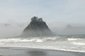 Misty Mountain with Forest on the seashore at Rialto Beach. Olympic National Park, WA Royalty Free Stock Photo