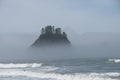 Misty Mountain with Forest on the seashore at Rialto Beach. Olympic National Park, WA Royalty Free Stock Photo