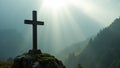 Misty mountain iron cross with moss illuminated by a sacred beam of light Royalty Free Stock Photo
