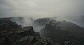Misty Mountain Landscape with Dark Rocks Royalty Free Stock Photo