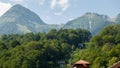 Misty mountain landscape with fir forest. Beautiful landscape with mountain view, cable car