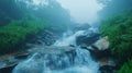 Misty Mountain Waterfall Cascading Over Dark Rocks Royalty Free Stock Photo