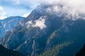 Misty mountains and human villages Royalty Free Stock Photo