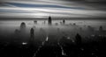 Misty new york city skyline at dawn with dramatic cloud patterns Royalty Free Stock Photo
