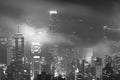 Misty night view of Victoria harbor in Hong Kong city Royalty Free Stock Photo