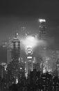 Misty night view of Victoria harbor in Hong Kong city Royalty Free Stock Photo
