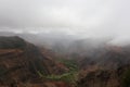 A Misty Rain Falling Over Waimea Canyon On A Cloudy Day In Waimea Canyon State Park, Kauai