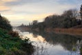 Misty river in winter with reflections in the water