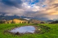 Misty scenery with small lake at sunrise, Transylvania, Romania Royalty Free Stock Photo