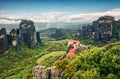 Misty spring scene in Meteora, UNESCO World Heritage site. Collorful morning view of Eastern Orthodox monasteries, built on top of