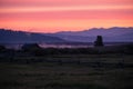 A misty sunrise dawning over the mountains in West Yellowstone