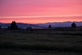 A misty sunrise dawning over the mountains in West Yellowstone