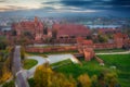 Misty sunrise over the Malbork castle and Nogat river in Poland Royalty Free Stock Photo